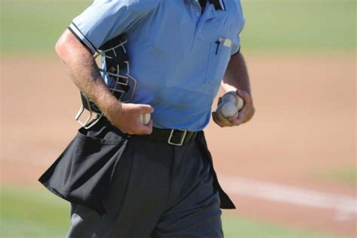 Why do umpires wear blue?
